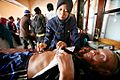 Indonesian nurse examines patient