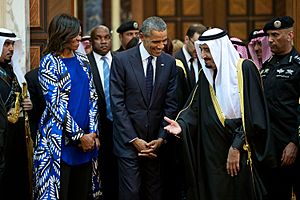 President Barack Obama and First Lady Michelle Obama walk with King Salman of Saudi Arabia at Erga Palace in Riyadh, Saudi Arabia, Jan. 27, 2015