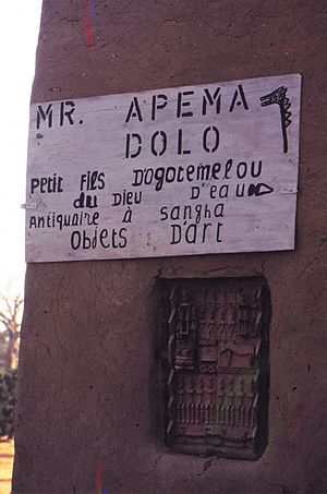 ASC Leiden - W.E.A. van Beek Collection - Dogon tourism 04 - Inscription on a wall. The art dealer is the grandson of a famous Dogon, Sangha Mali, 1990