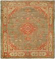 Antique oushak carpet with a pale red and green tone