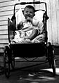 Boy in baby buggy, 1935