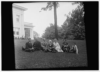 Group picture of Orville Wright, Bishop Milton Wright, Katharine Wright, Earl N. Findley, nephew Horace Wright, John R. McMahon, and Pliny Williamson, all seated on the lawn of Orville's home, Hawthorn Hill; Dayton, Ohio