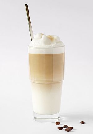 Latte macchiato with coffee beans