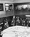 The Operations Room at RAF Fighter Command's No. 10 Group Headquarters, Rudloe Manor (RAF Box), Wiltshire, showing WAAF plotters and duty officers at work, 1943. CH11887