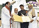 The President, Shri Pranab Mukherjee presenting the Dada Saheb Phalke Award to the Director Shri K. Vishwanath, at the 64th National Film Awards Function, in New Delhi.jpg