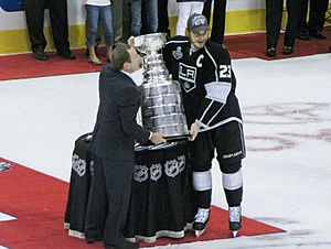 Captain Dustin Brown receiving Stanley Cup from NHL Commissioner Gary Bettman (7476660930)