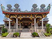 Front façade of a Chinese clan house featuring ornate carvings on the roof.