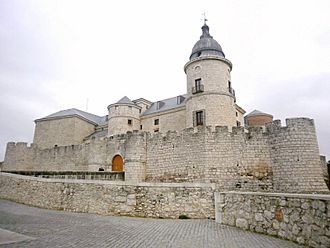 A fortress with an outer wall, a bridge to an inner wall and a tower.