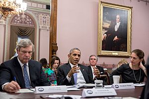 Barack Obama flanked by Agriculture Secretary Tom Vilsack, left, and Health and Human Services Secretary Sylvia Mathews-Burwell at right, 2016