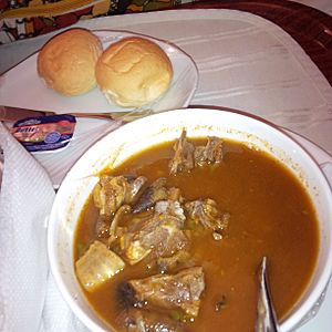Goat meat pepper soup served with bread