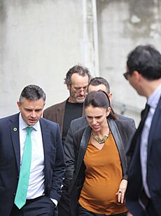 James Shaw and a pregnant Jacinda Ardern walk with group 2018