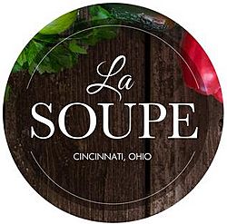 logo of La Soupe, a stylized wooden plate and partial images of produce, with the words "La Soupe" large and centered on the plate and "Cincinnati, Ohio" in block letters centered under the organization name