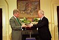President Bill Clinton receives a traditional crystal bowl of Shamrocks from Prime Minister John Bruton of Ireland