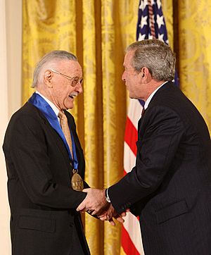 President George W. Bush congratulates Stan Lee