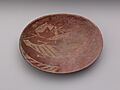 A shallow white cross-lined ware bowl illustrating a man on a boat alongside a hippo and crocodile MET DP259217