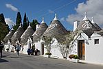 Small white houses with conic roofs