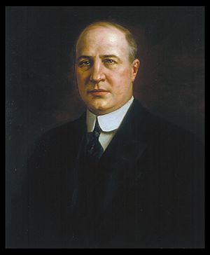 A color portrait of a balding man in his late forties