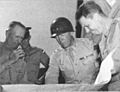 General George S. Patton Jr. (center) and General Lesley J. McNair (left)