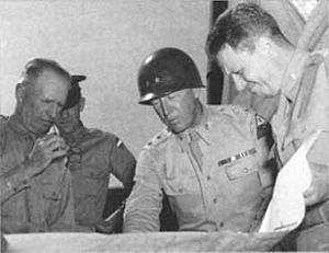 General George S. Patton Jr. (center) and General Lesley J. McNair (left)