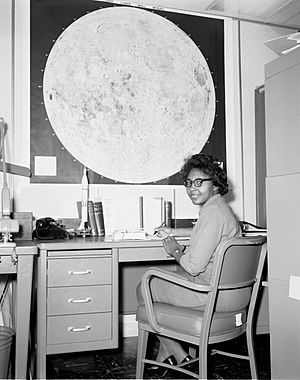 Jeanette Scissum sitting at her desk in NASA