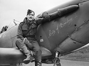 Squadron Leader H J L Hallowes, CO of No. 122 Squadron, with his Supermarine Spitfire Mk V at Scorton in Yorkshire, December 1941. CH4275