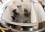 US Navy 101104-N-4044H-133 Navy SEALs conduct close quarters combat training in a simulated home at U.S. Training Center Moyock