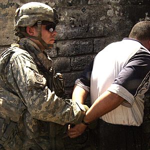 American Airborne Soldier arresting an Iraqi suspect