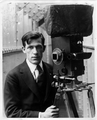 Arthur Miller (cinematographer) with 1912 Pathé 35mm movie camera.webp