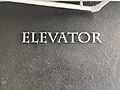 Building sign displaying the word elevator