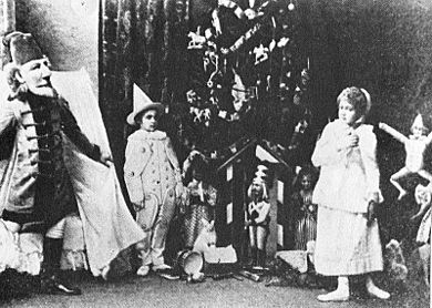 Nutcracker -Scene from Act I -Sergei Legat as Nutcracker, Stanislava Stanislavovna Belinskaya as Clara, & Unidentified as a Gingerbread Soldier -1892