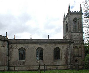 A stone church with a square tower