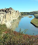 Sandstones of the Milk River Formation flank the Milk river at Writing-on-Stone Provincial Park, Alberta.