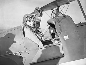 Pauline Gower, Commandant of the Air Transport Auxiliary Women's Section, waving from the cockpit of a de Havilland Tiger Moth at Hatfield, Hertfordshire, prior to a delivery flight, 10 January 1940. C380