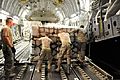 U.S. Airmen with the 386th Expeditionary Logistics Readiness Squadron load pallets of humanitarian relief supplies onto a C-17 Globemaster III aircraft at an undisclosed location in Southwest Asia June 4, 2013 130604-F-KL201-115