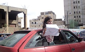 A Benghazi girl holding a paper