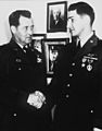 A USAF Hospital in Japan-Capt Lyle B. Bordeaux (right), Bowling Green, OH, USAF B-29 pilot, receives the Silver Star, and the Purple Heart, from Brig Gen Joe W. Kelly, FEAF Bomber Command Chief, plus HF-SN-98-07469