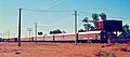 Central Australia Railway -- The Ghan (narrow-gauge) ready to depart Alice Springs ca 1973 (Hugh S Williams)