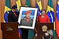 Dilma Rousseff receiving a Hugo Chávez picture from Nicolás Maduro