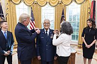 Donald Trump participates in the promotion pinning ceremony for Charles McGee