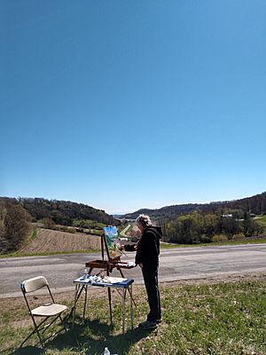 Martha Hayden painting outside 2019.jpg