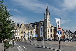 Street banners welcome visitors to Poperinge's Town Hall and Grote Market