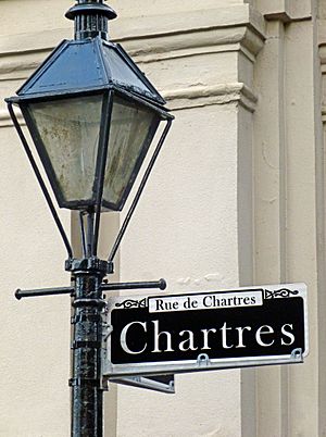Streetlight and sign in the French Quarter of New Orleans, part of the Louisiana State Museum