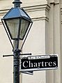 Streetlight and sign in the French Quarter of New Orleans, part of the Louisiana State Museum