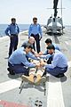 US Navy 100605-N-3973P-124 Pakistani navy Surgeons and Hospital Corpsman 2nd Class Nicholas Marcotte use a raven litter stretcher to transport Hospital Corpsman 2nd Class William West during a medical training exercise