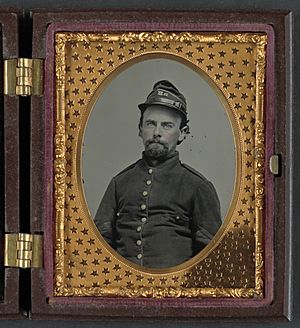 Unidentified soldier in Confederate uniform and Richmond Howitzers artillery unit hat LCCN2011647963