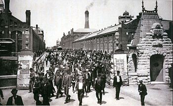 Workers leave the Pullman Palace Car Works, 1893
