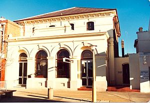 433 - CBA Bank (former) - Front of former CBA Bank Armidale (former Telegraph Office). 1985, showing the building with infilling to portico consisting of rendered cement bases to windows, and metal framed glazed doors. (5045355b3).jpg