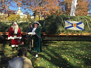 A Town Crier and Santa Claus welcome the Boston Christmas Tree