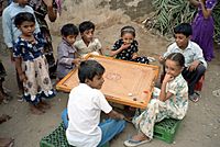 Children playing carrom in Yemen