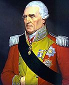 White haired man with red military jacket, decorated in yellow, with epaulets on his shoulders, a ribbon sash, and military decorations.